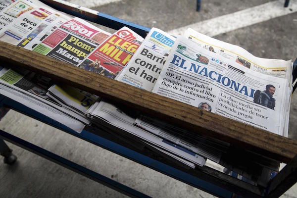 Copy of the El Nacional newspaper is seen among others on a shelf at a kiosk in Caracas