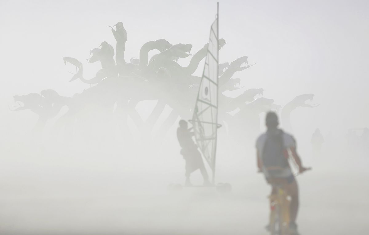 Dust blows past an art installation as approximately 70,000 people from all over the world gather for the 30th annual Burning Man arts and music festival in the Black Rock Desert of Nevada, U.S. August 30, 2016. Picture taken August 30, 2016. REUTERS/Jim Urquhart FOR USE WITH BURNING MAN RELATED REPORTING ONLY. FOR EDITORIAL USE ONLY. NOT FOR SALE FOR MARKETING OR ADVERTISING CAMPAIGNS. NO THIRD PARTY SALES. NOT FOR USE BY REUTERS THIRD PARTY DISTRIBUTORS. - RTX2NPPF